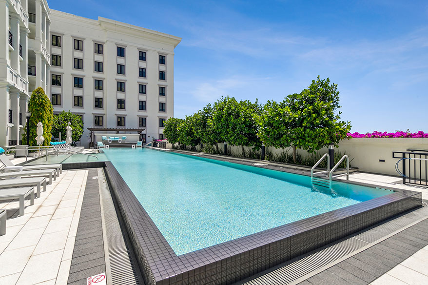 Swimming pool and side view of Life Time Living at Gables Station